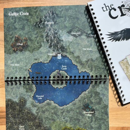 Map notebook with a detailed map on a wooden surface