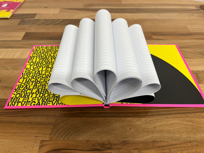 Open book with a colorful cover on a wooden surface