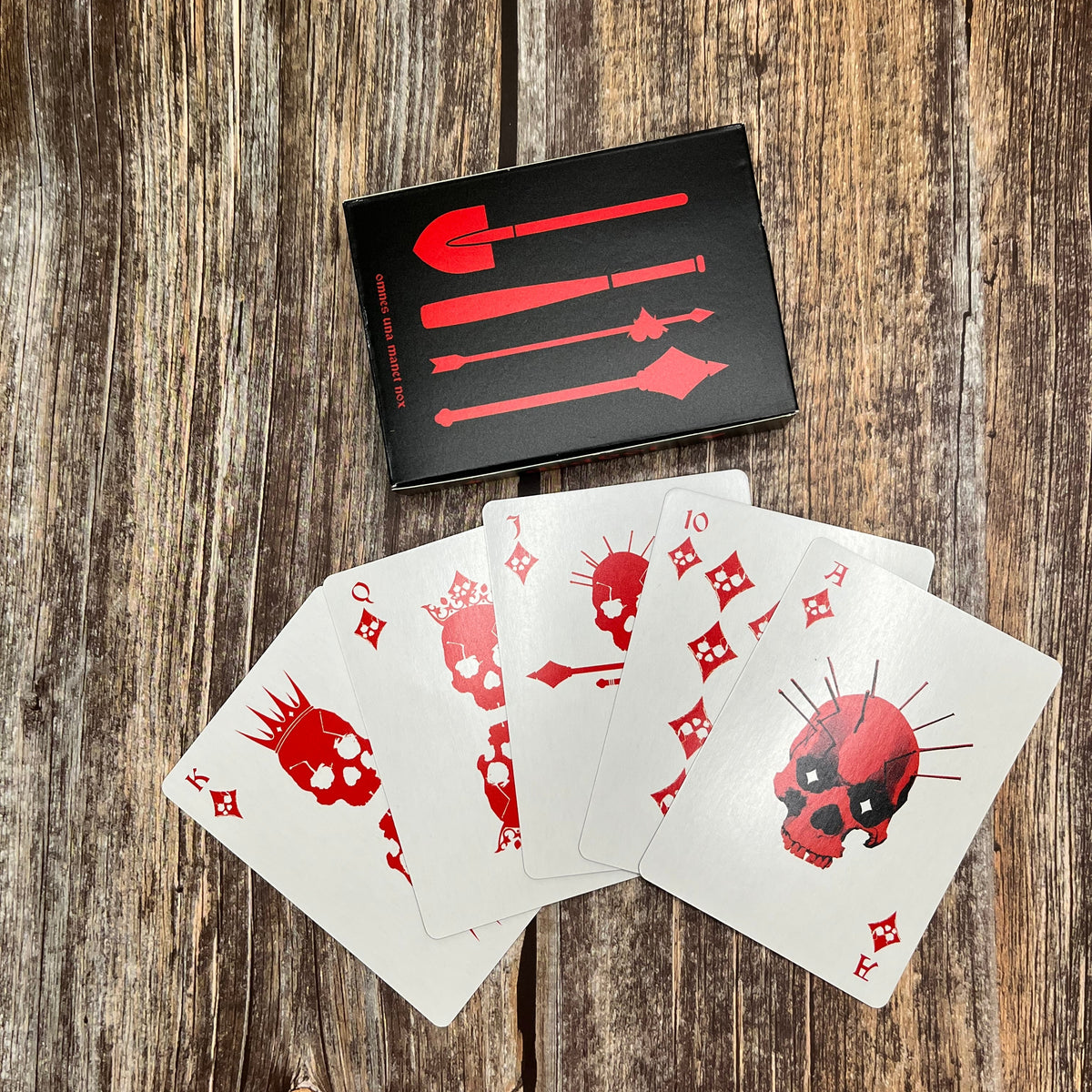poker deck court cards which are red for the diamond suit and have skulls