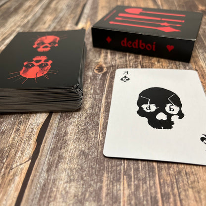 skull poker deck showing the black box and the backs of the cards

