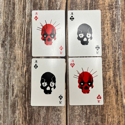 Each of the Ace court cards from a red and black skull poker deck
